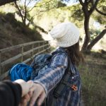 unrecognizable woman offering follow her 1