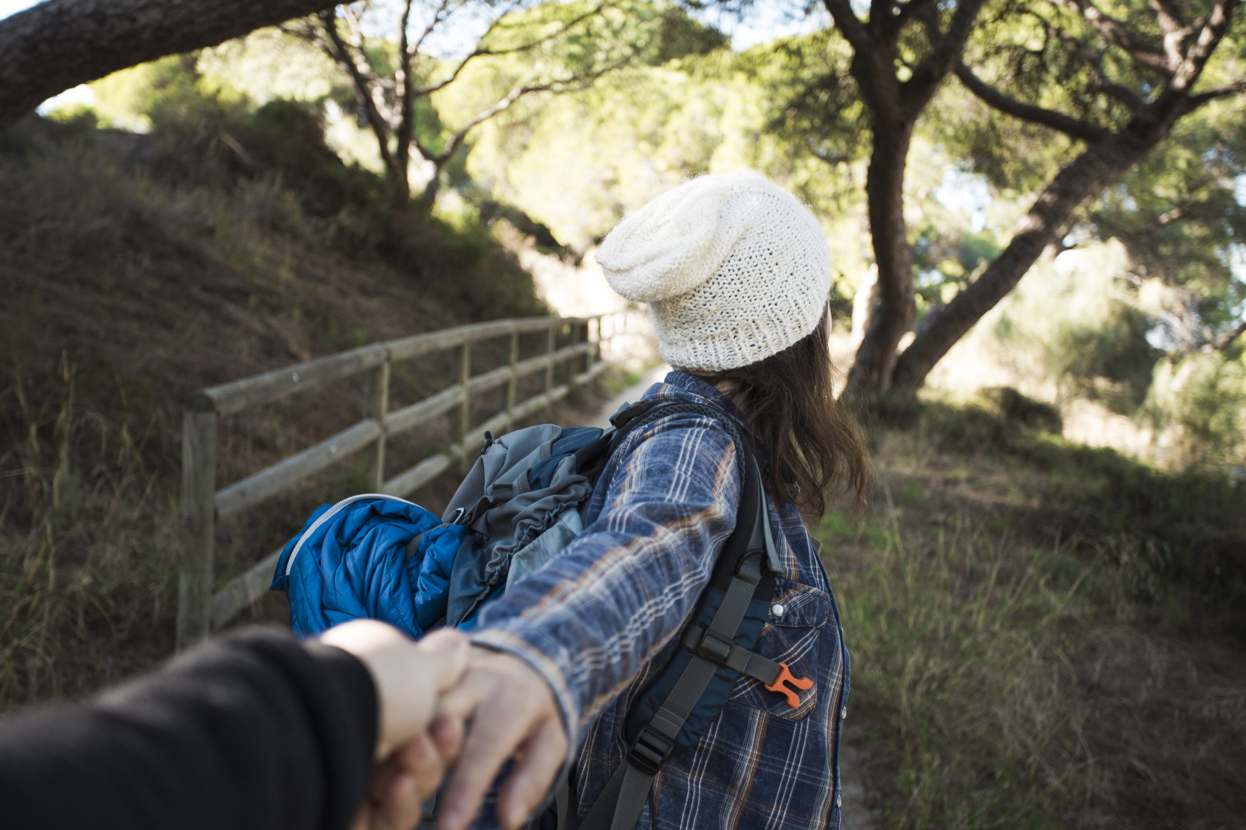 unrecognizable woman offering follow her 1