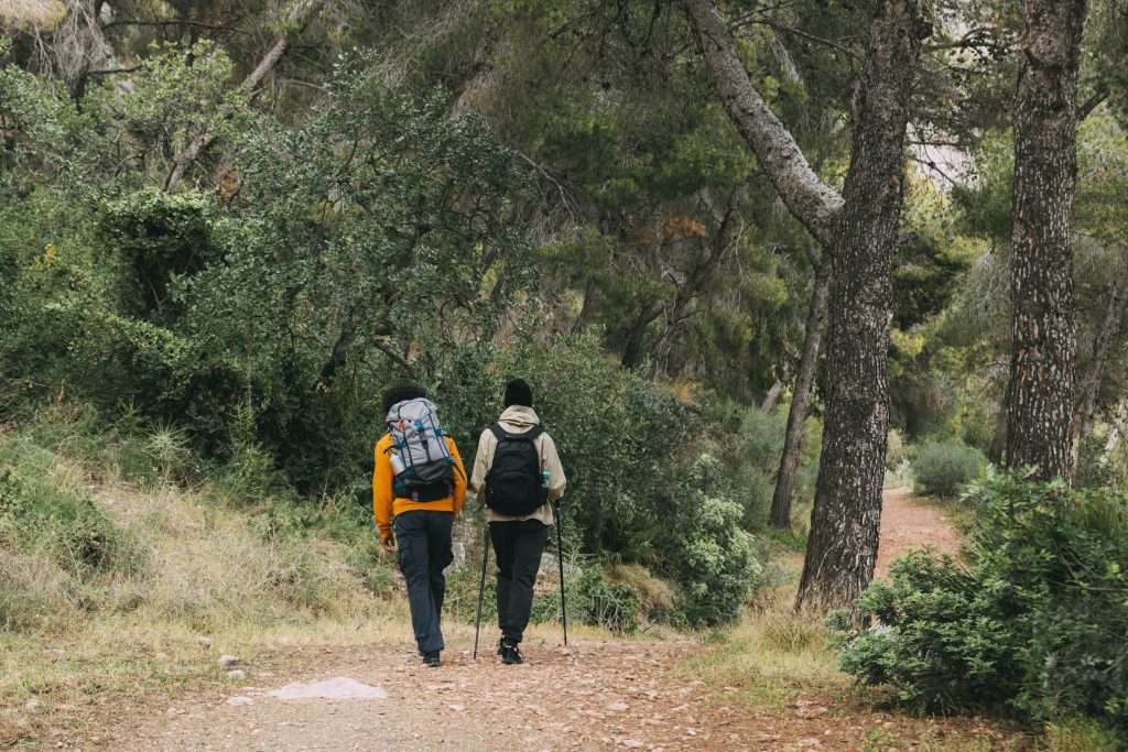 men trekking nature